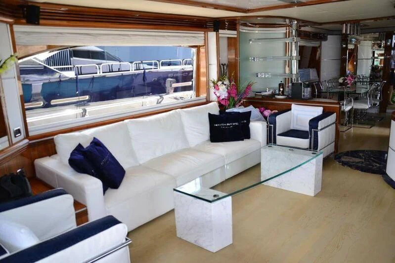 a living room with a large window aboard HITECH RACING Yacht for Sale