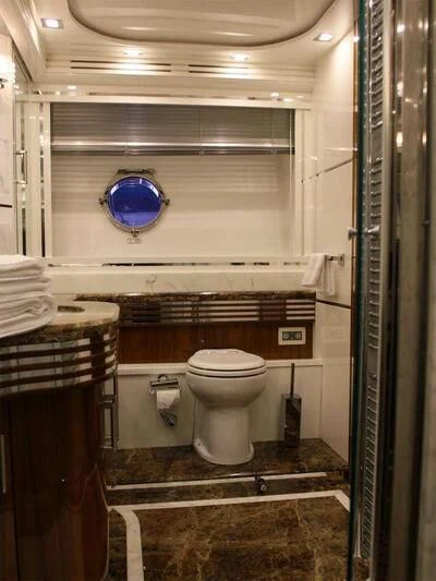 a toilet in a bathroom aboard HITECH RACING Yacht for Sale