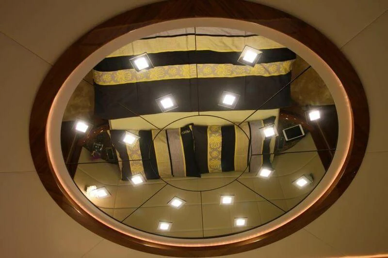 a reflection of a car in a round mirror aboard HITECH RACING Yacht for Sale
