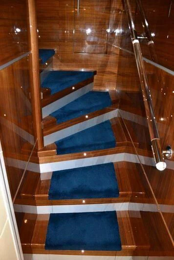 a set of stairs in a room aboard HITECH RACING Yacht for Sale