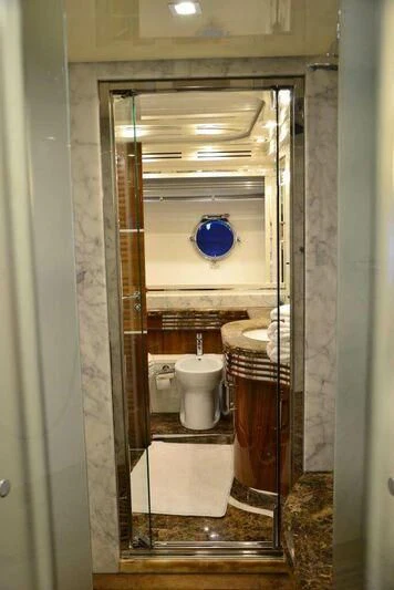 a bathroom with a toilet and sink aboard HITECH RACING Yacht for Sale