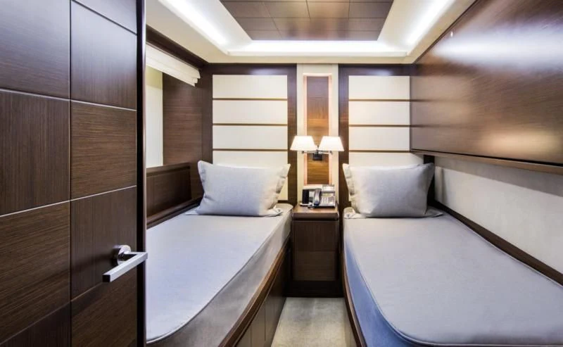 a room with a bed and a desk aboard AMANECER Yacht for Sale