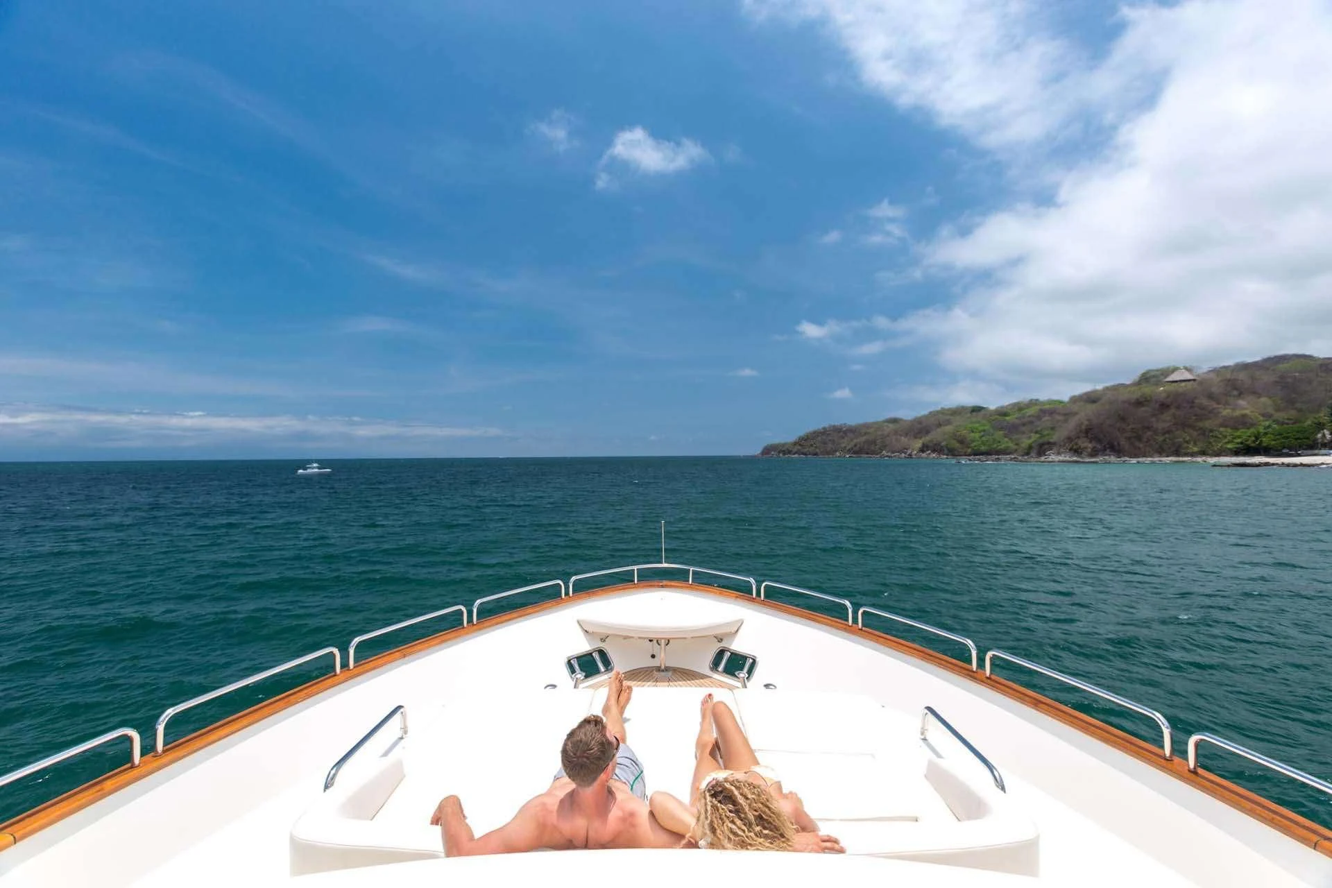 a couple on a boat aboard AMANECER Yacht for Sale