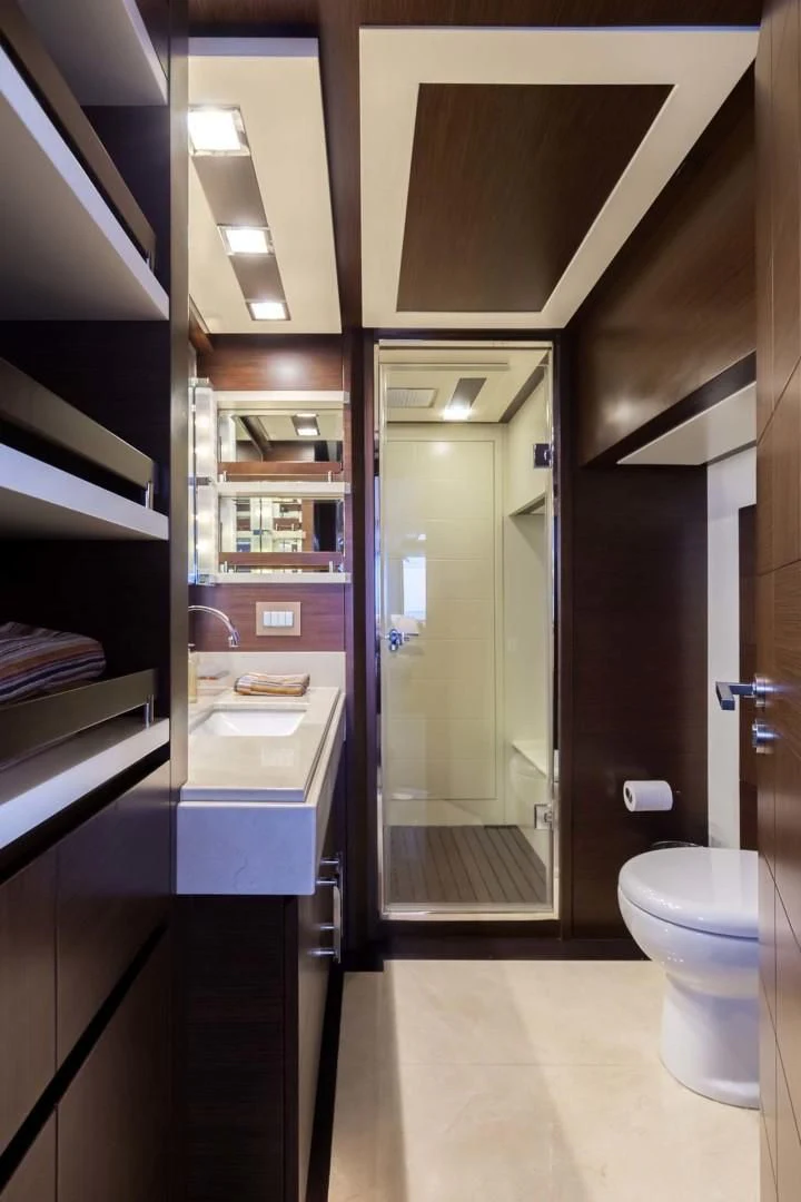 a bathroom with a glass shower aboard AMANECER Yacht for Sale