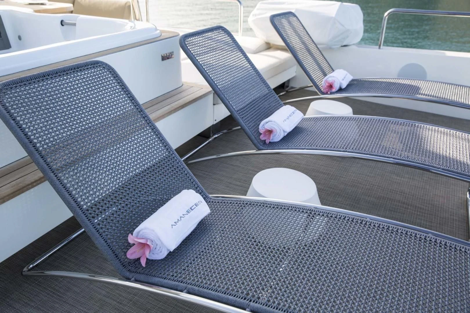 a cat lying on a chair aboard AMANECER Yacht for Sale
