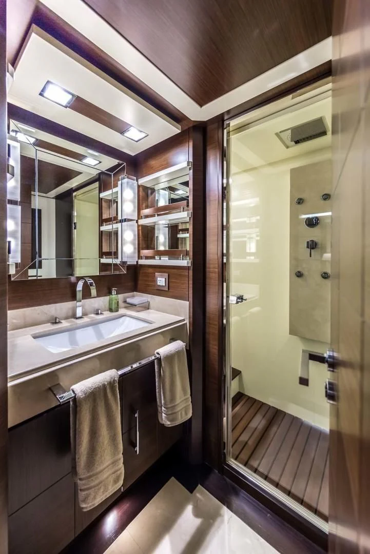 a bathroom with a sink and mirror aboard AMANECER Yacht for Sale