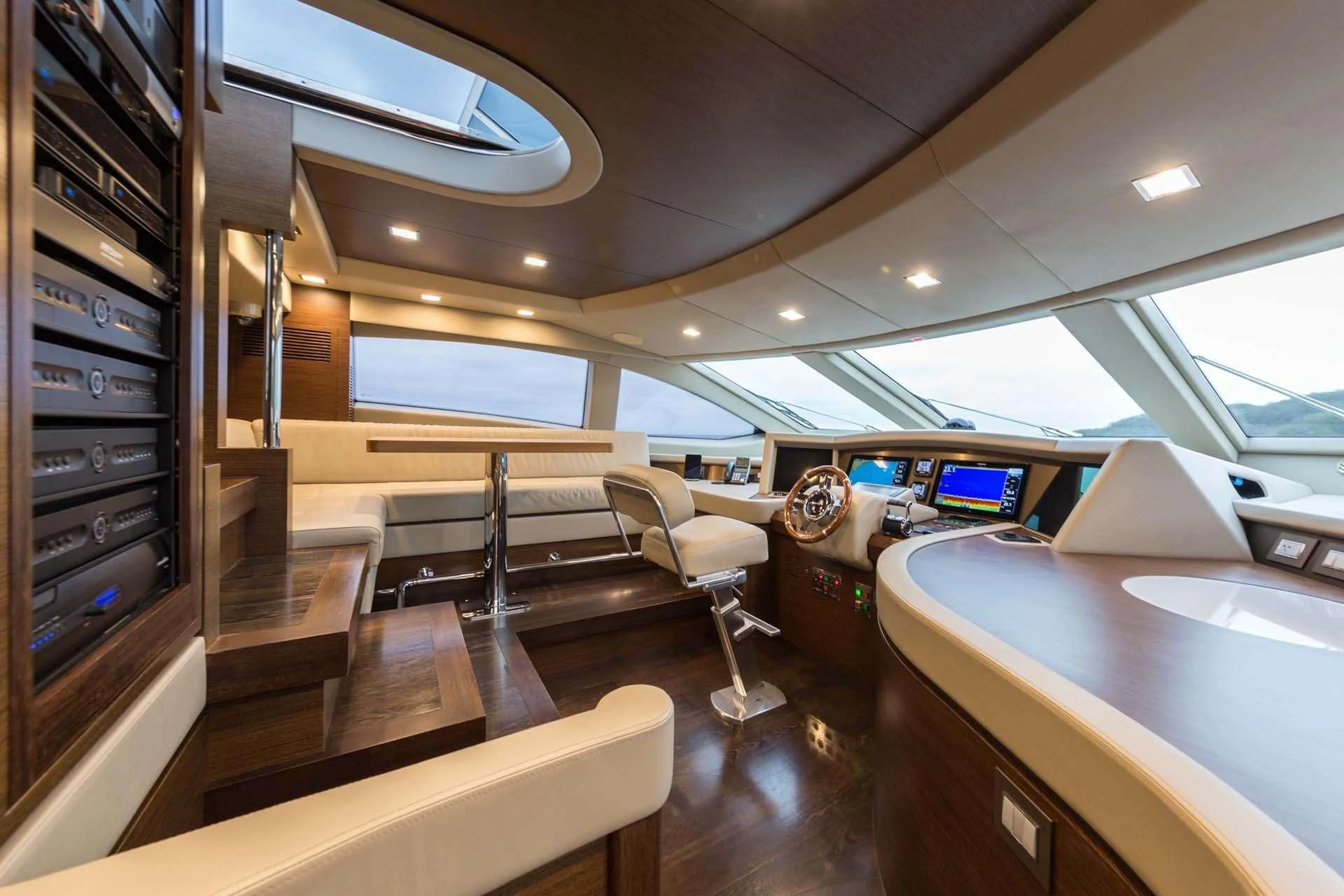 a room with desks and chairs aboard AMANECER Yacht for Sale