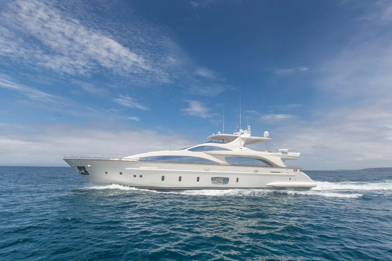 a white yacht in the water aboard AMANECER Yacht for Sale