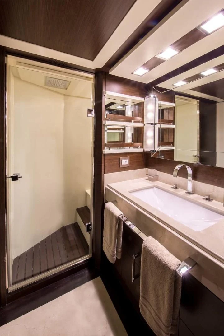 a bathroom with a sink and a mirror aboard AMANECER Yacht for Sale