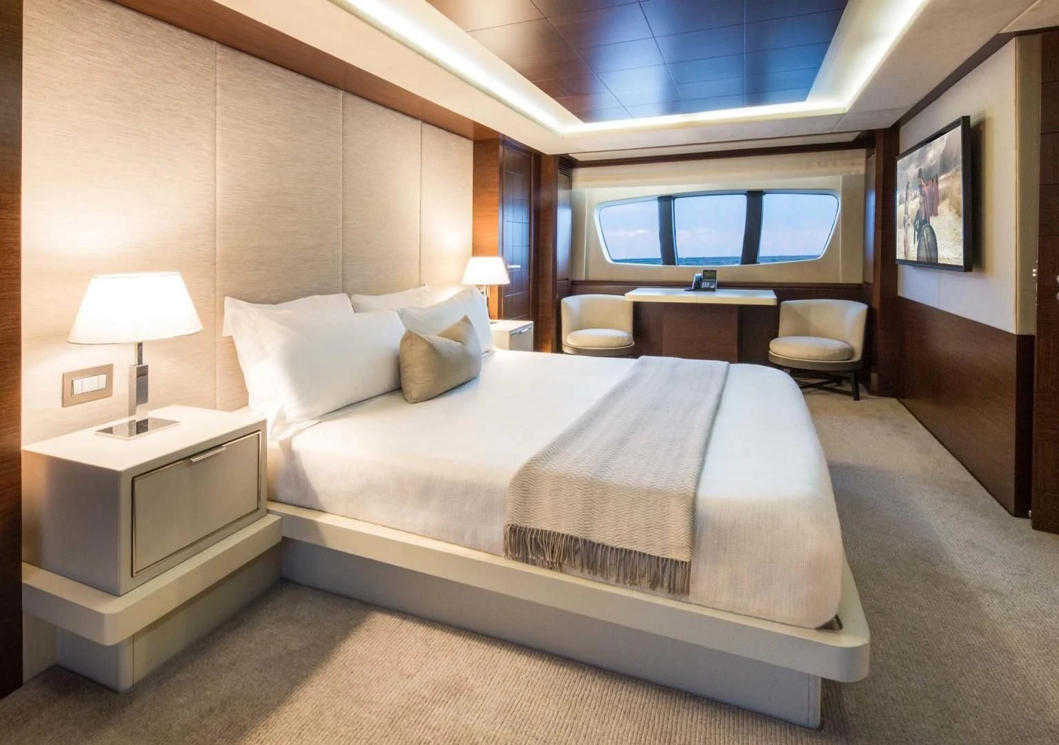 a hotel room with a bed and a desk aboard AMANECER Yacht for Sale