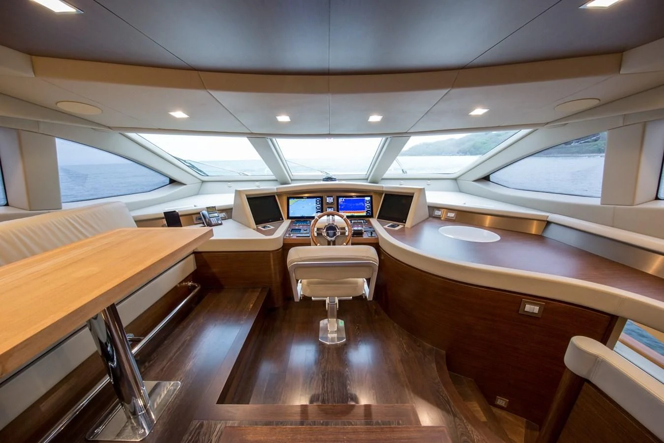 inside of a vehicle with chairs and computers on the floor aboard AMANECER Yacht for Sale