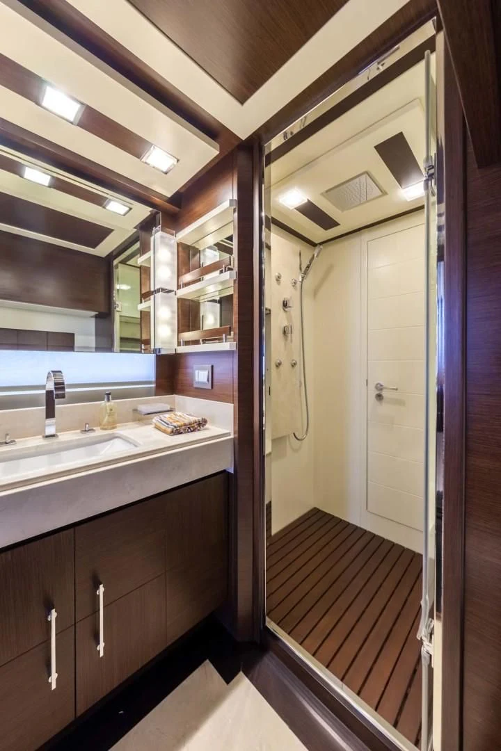 a bathroom with a sink and a mirror aboard AMANECER Yacht for Sale