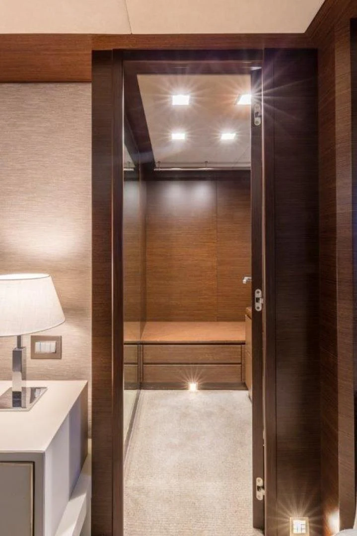 a room with a large glass door aboard AMANECER Yacht for Sale