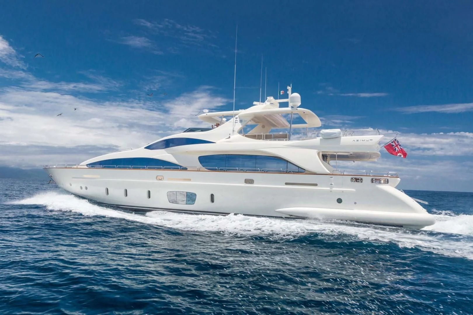 a white yacht in the water aboard AMANECER Yacht for Sale