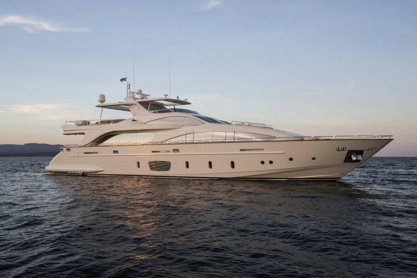 a white yacht on the water aboard AMANECER Yacht for Sale