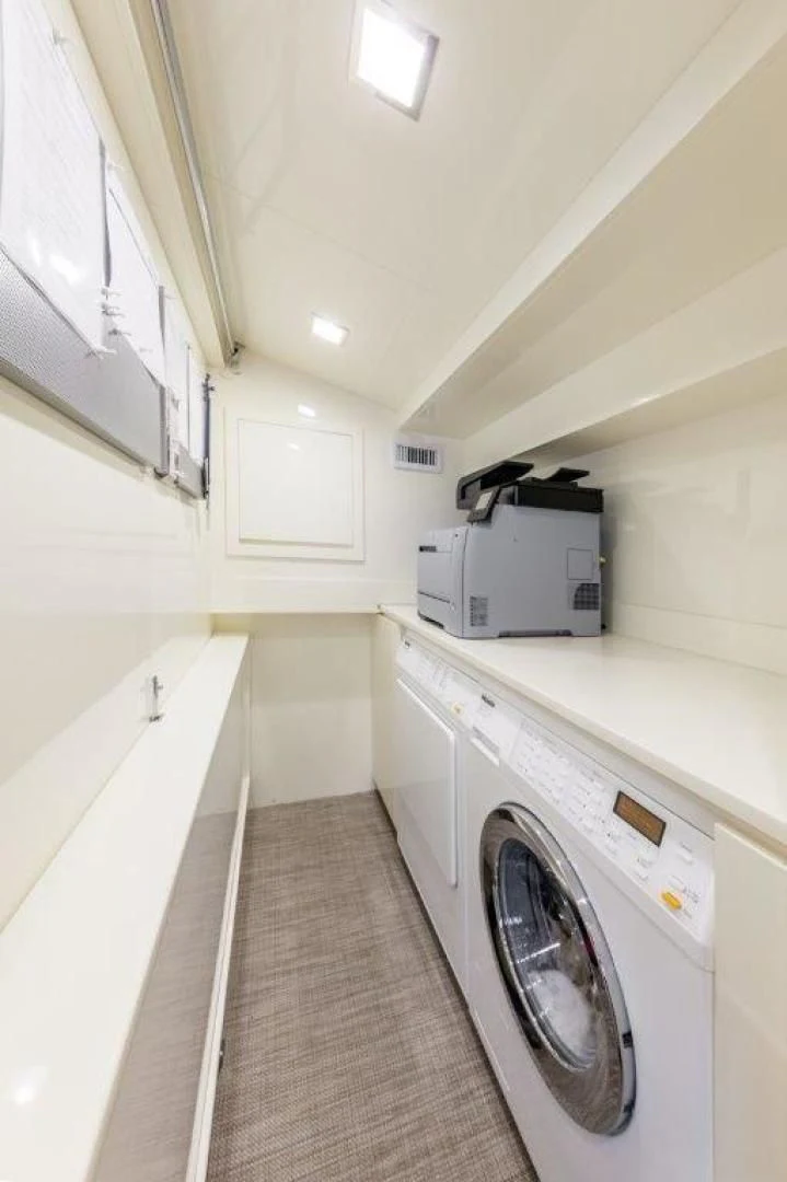 a laundry room with a washing machine aboard AMANECER Yacht for Sale