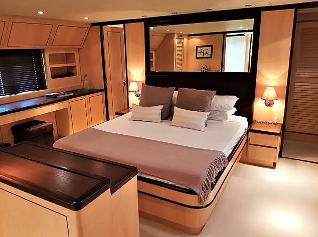a large bed in a room aboard CHURRI Yacht for Sale