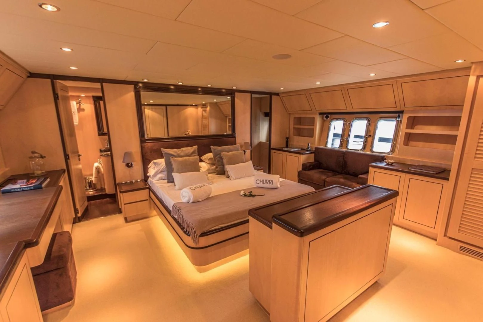 a large room with a bed and desk aboard CHURRI Yacht for Sale