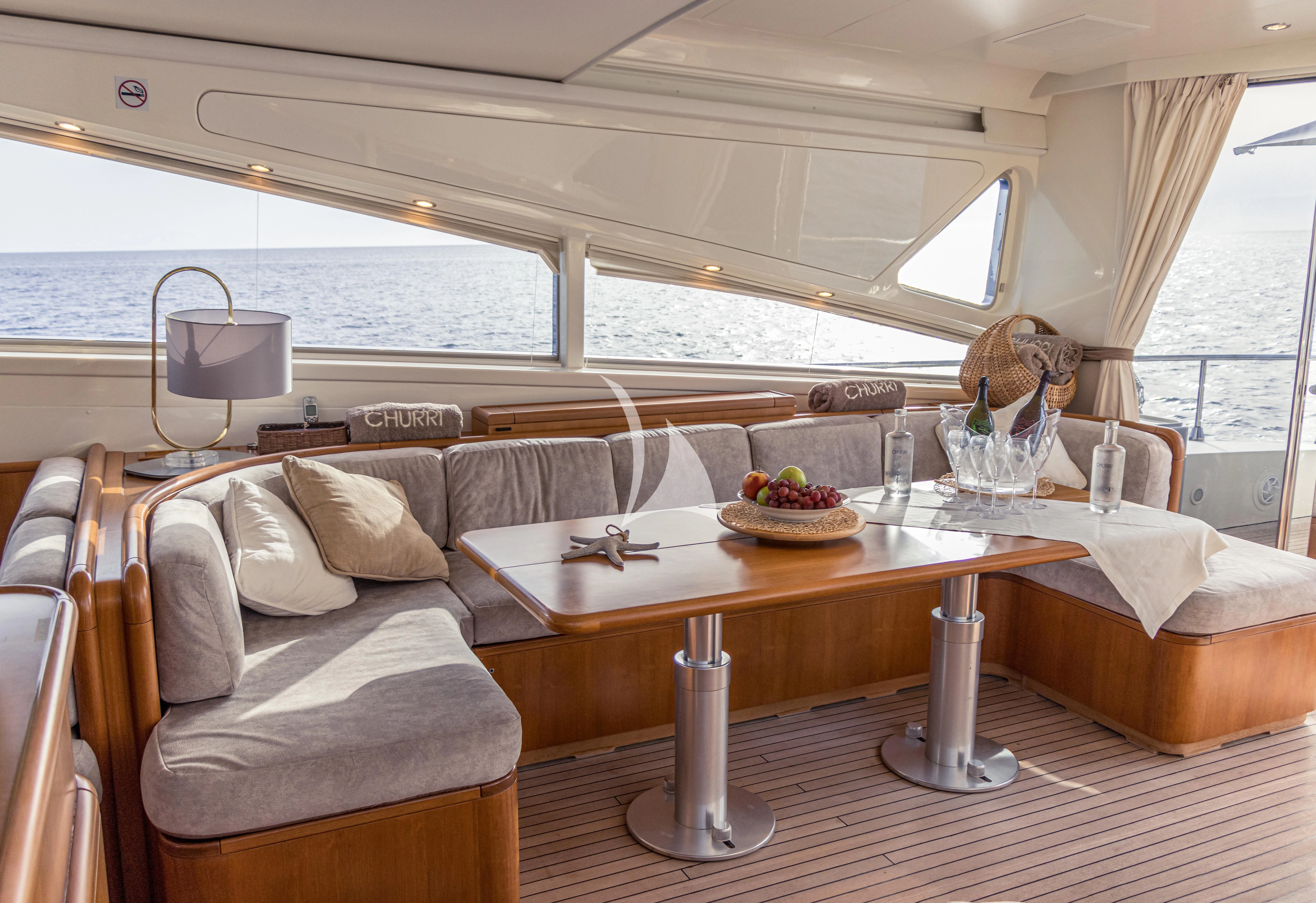 a living room with a couch and a table aboard CHURRI Yacht for Sale