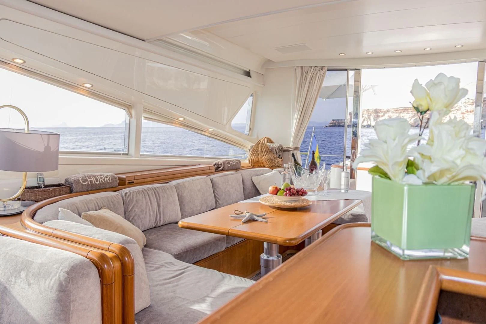 a living room with a couch and a table aboard CHURRI Yacht for Sale