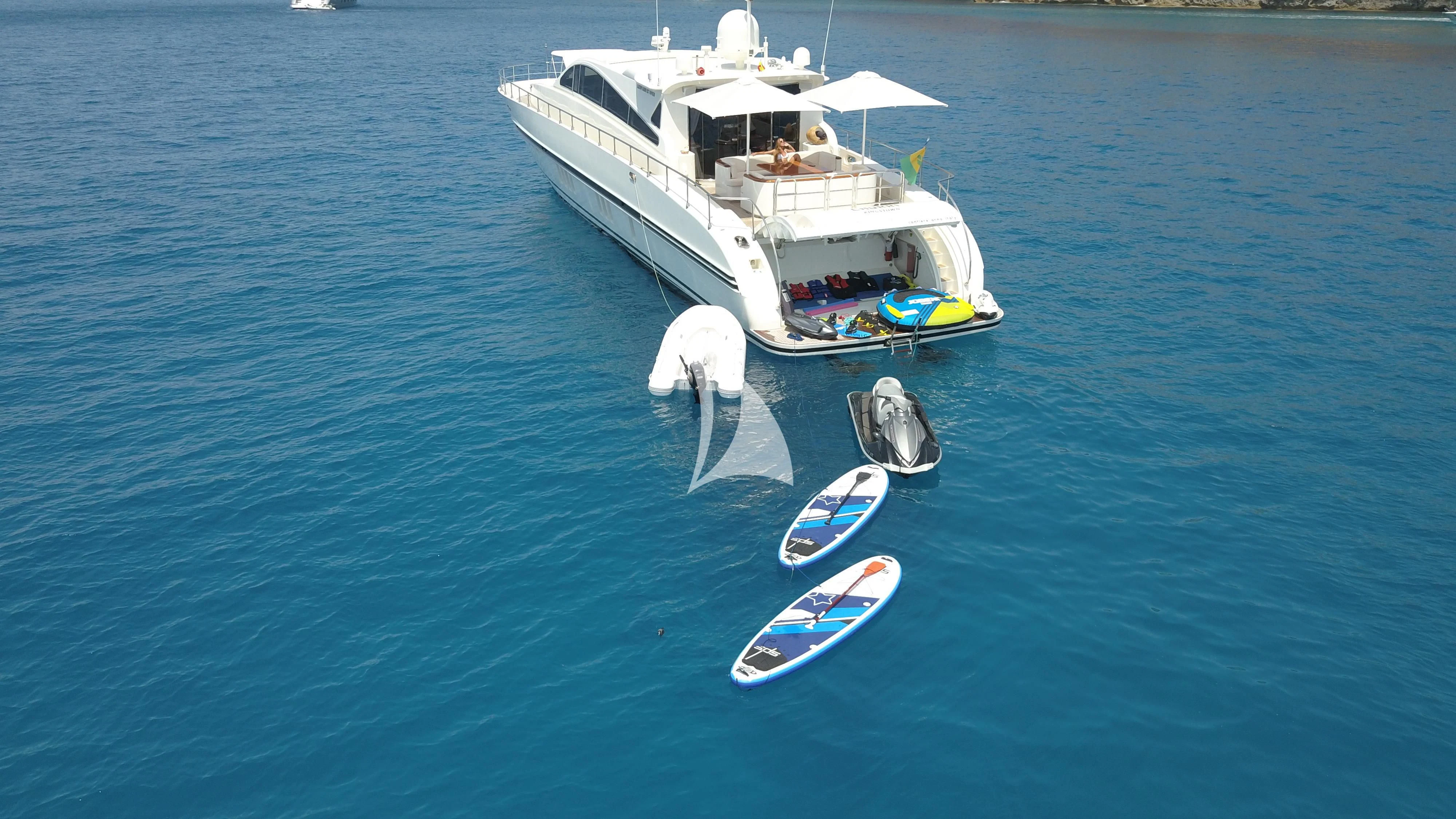 a boat with a dolphin in the water aboard CHURRI Yacht for Sale