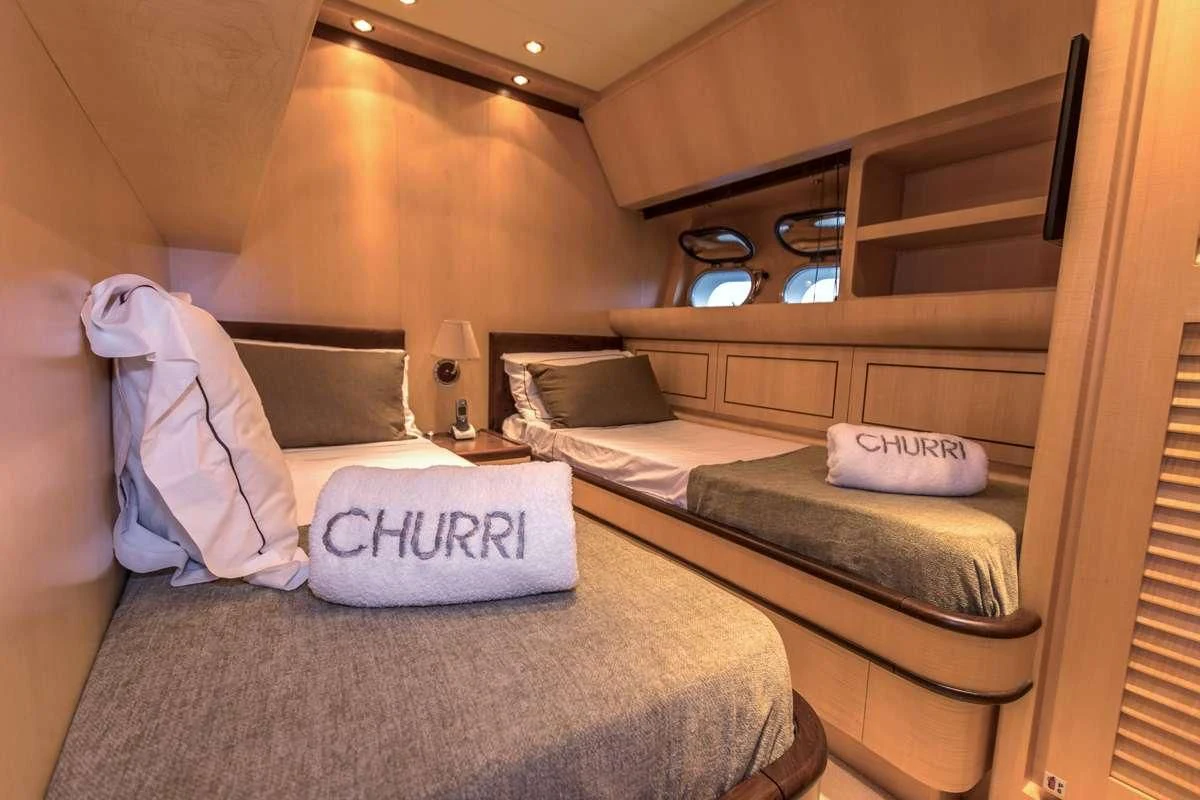 a room with two beds aboard CHURRI Yacht for Sale