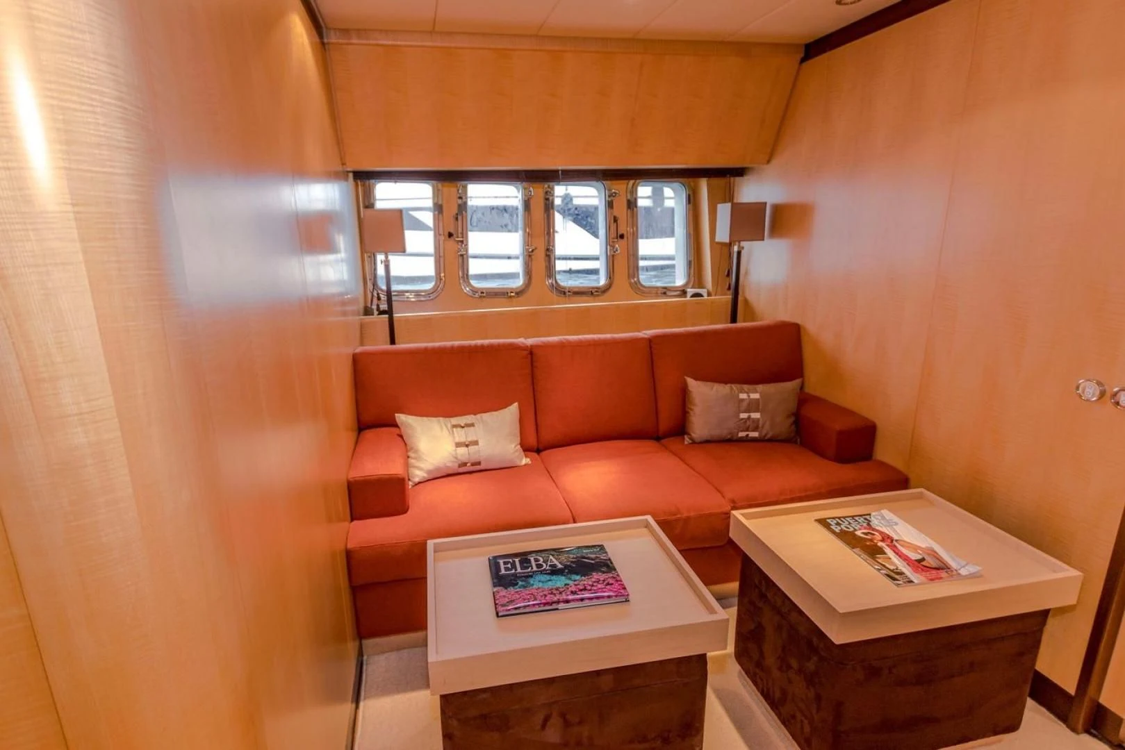 a living room with a couch and coffee table aboard CHURRI Yacht for Sale