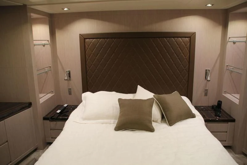a bed with pillows and a blanket aboard TSA TSA Yacht for Sale