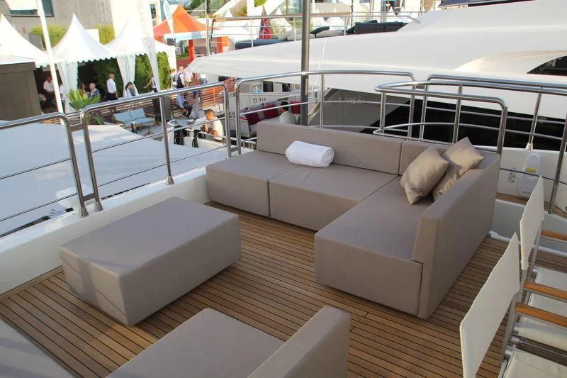 a room with a couch and a table with chairs aboard TSA TSA Yacht for Sale