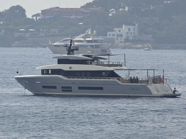 a large white yacht with a smaller boat on it aboard TSA TSA Yacht for Sale