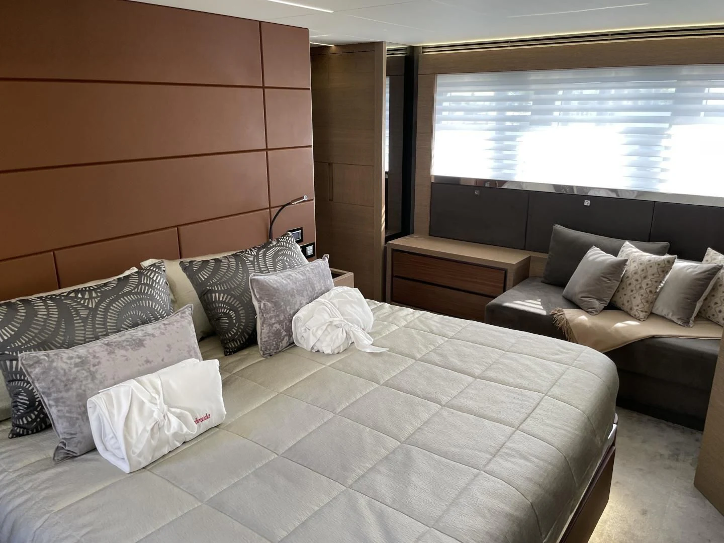 a bed with pillows and pillows aboard LEBRADA Yacht for Sale