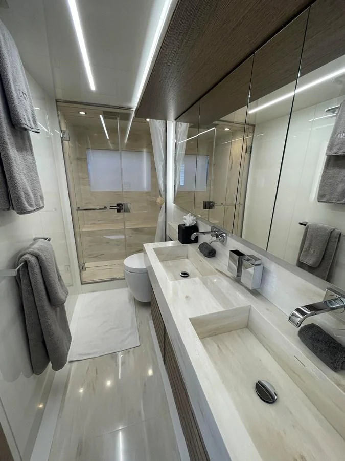 a bathroom with a large mirror aboard LEBRADA Yacht for Sale