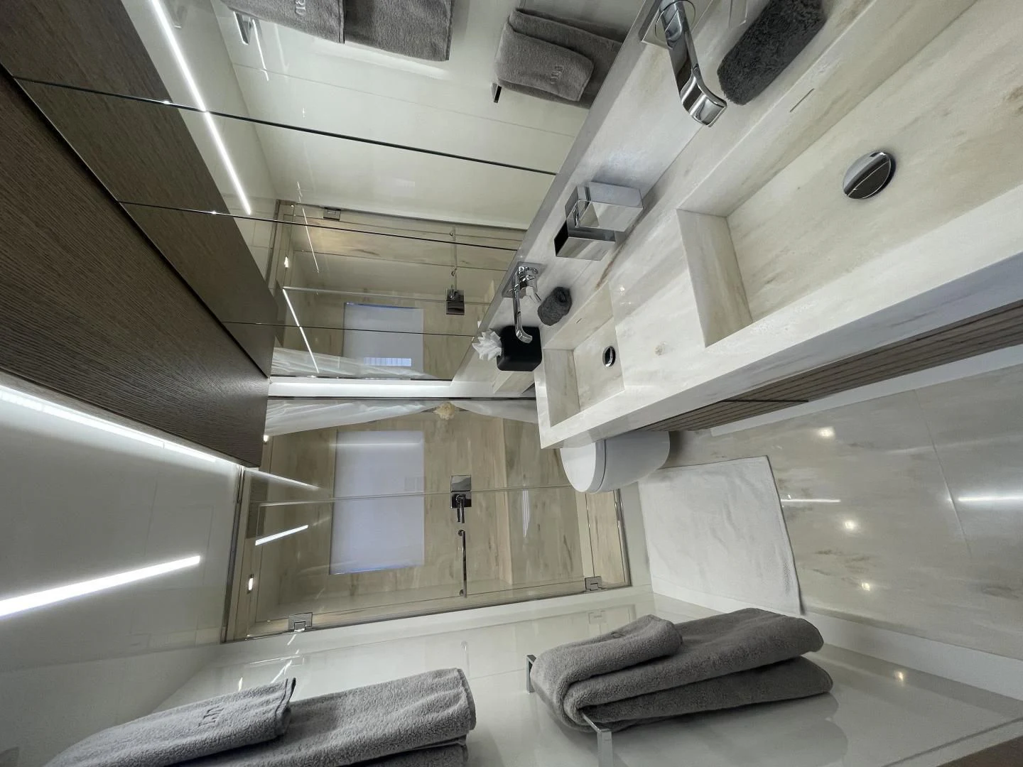a room with a bed and a chair aboard LEBRADA Yacht for Sale