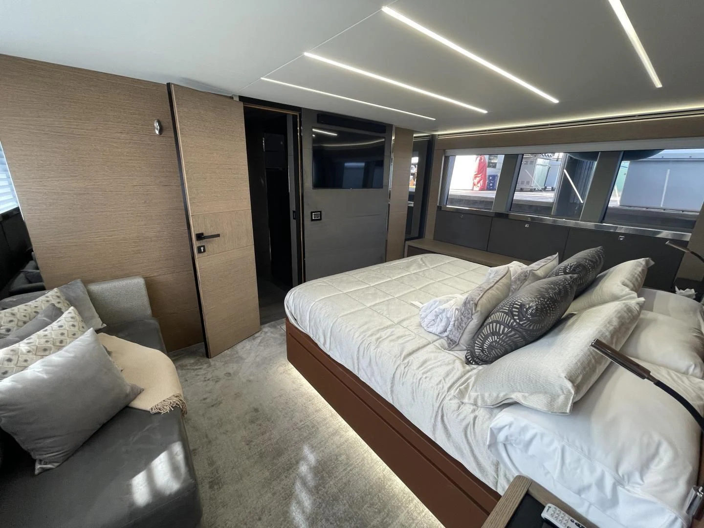 a room with a bed and a couch aboard LEBRADA Yacht for Sale