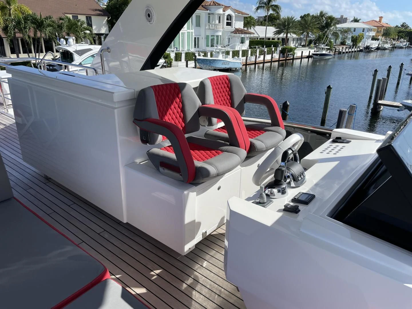 a white boat with red seats aboard LEBRADA Yacht for Sale