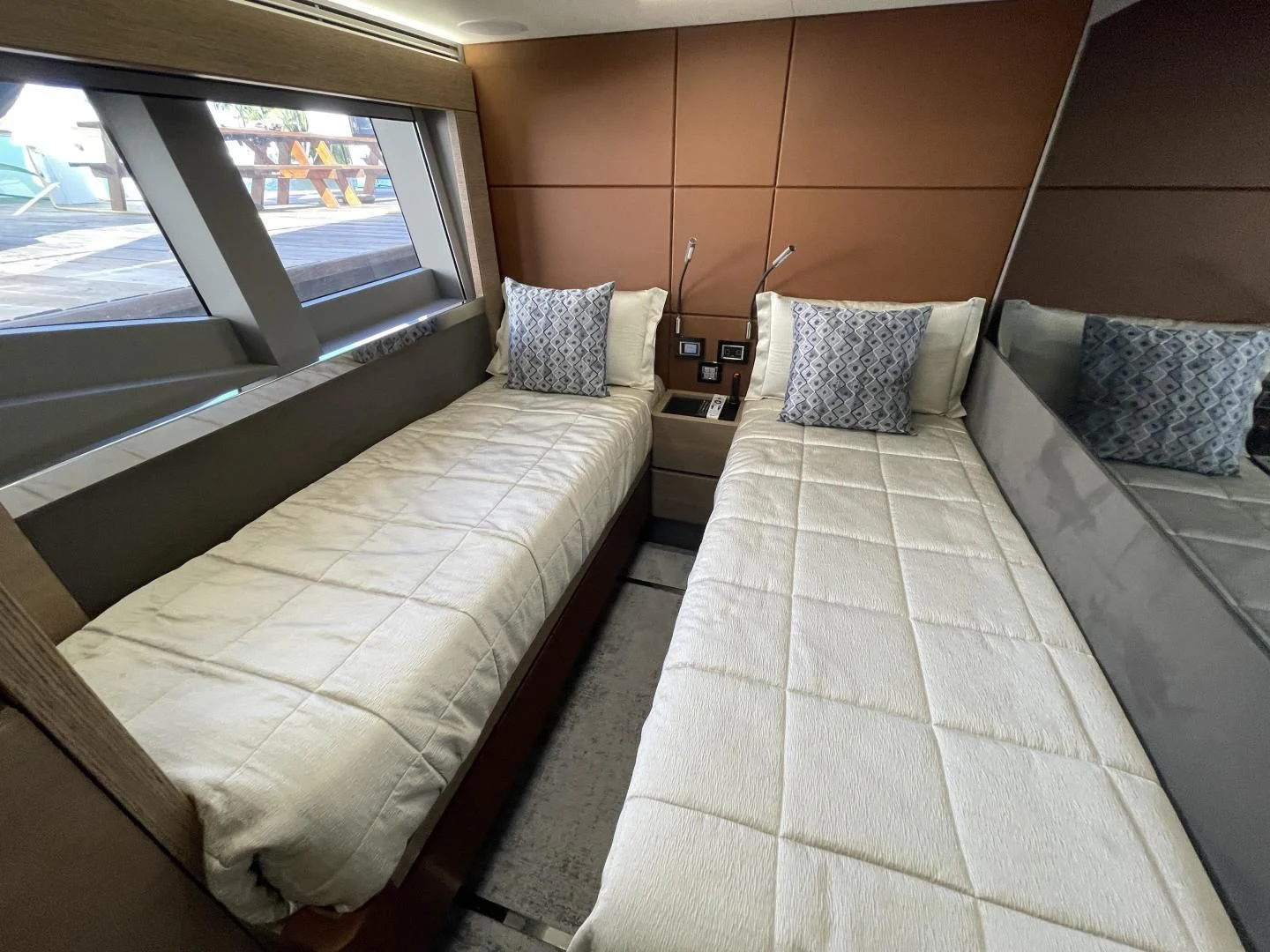 a room with two beds aboard LEBRADA Yacht for Sale