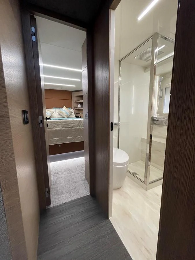 a bathroom with a glass shower aboard LEBRADA Yacht for Sale