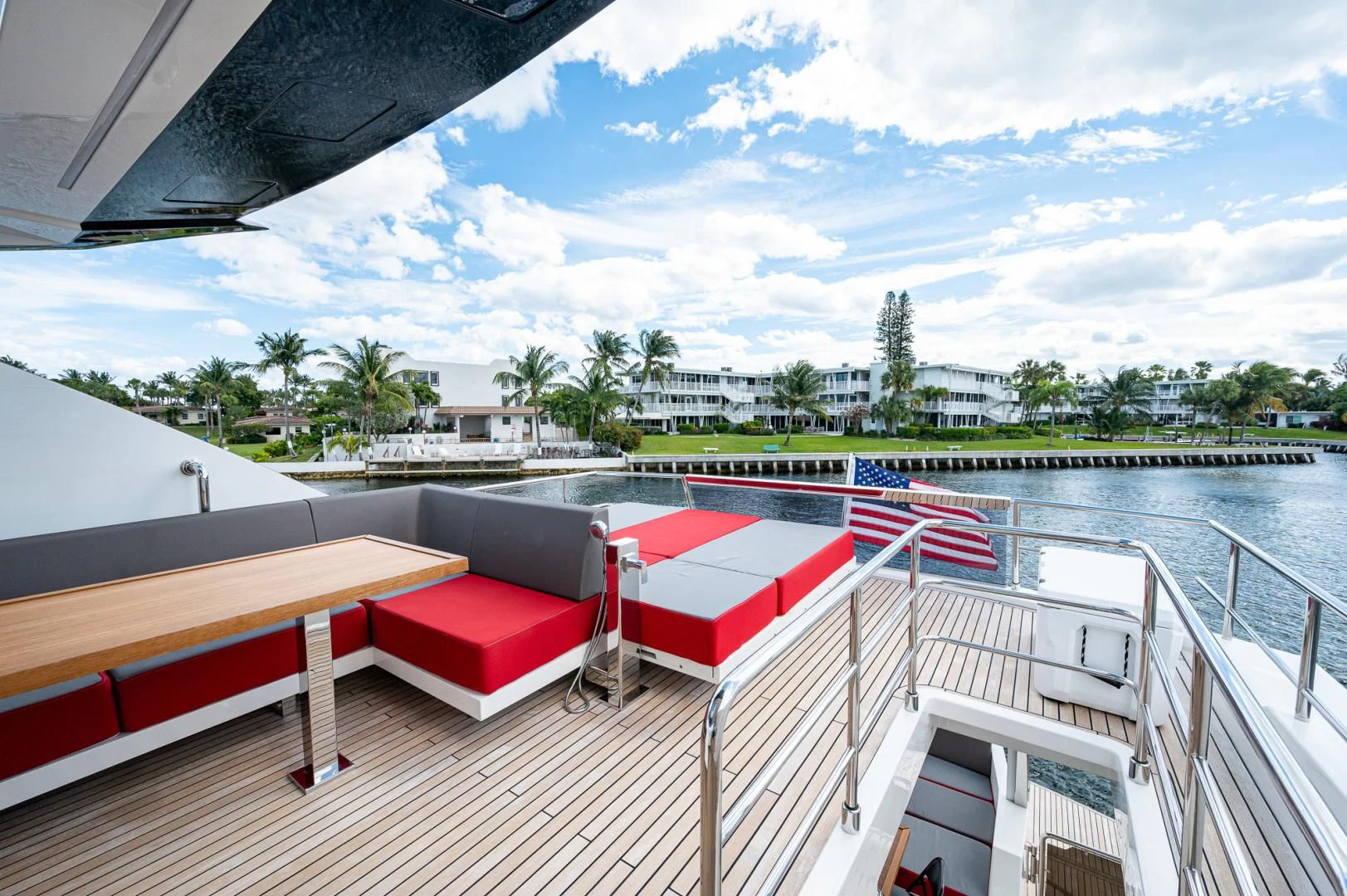 a deck with a pool and trees aboard LEBRADA Yacht for Sale