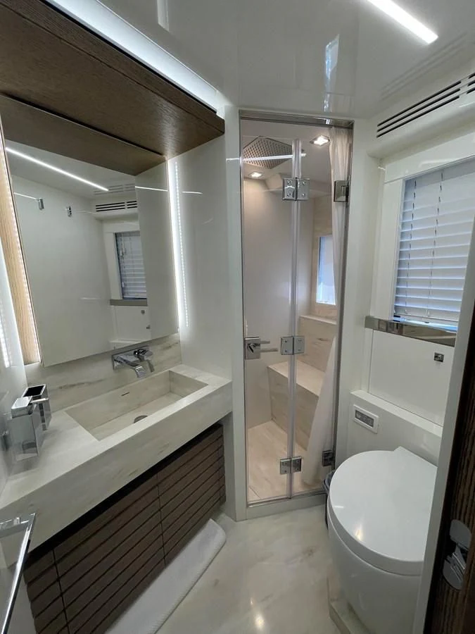 a bathroom with a glass shower aboard LEBRADA Yacht for Sale