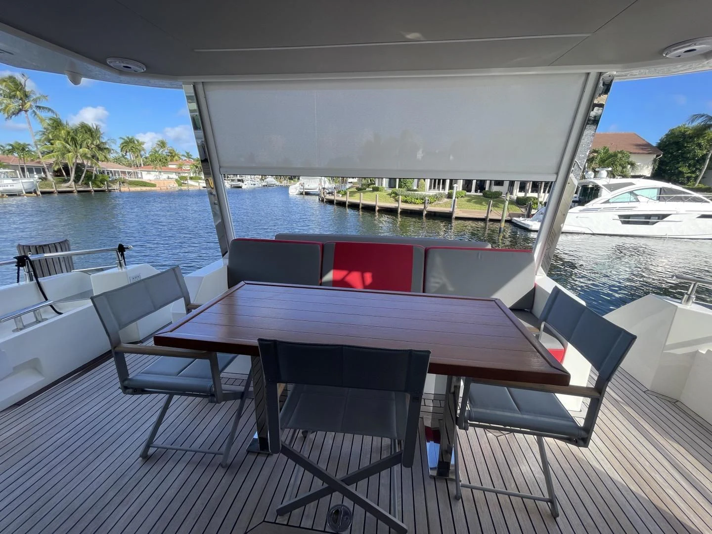 a table and chairs on a deck aboard LEBRADA Yacht for Sale