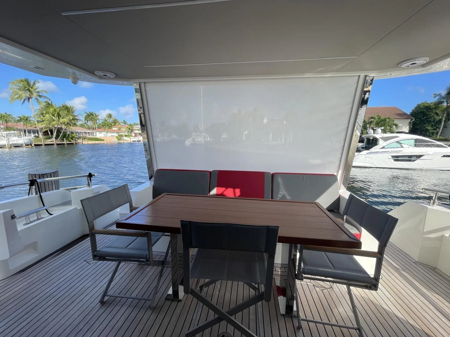 a table and chairs on a deck aboard LEBRADA Yacht for Sale