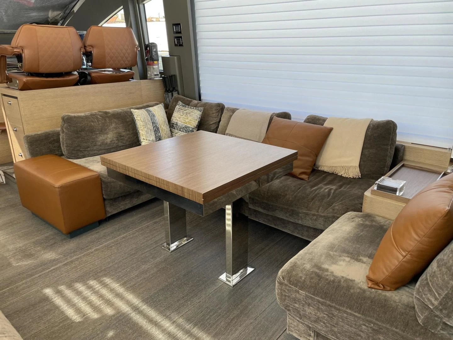 a living room with a couch and coffee table aboard LEBRADA Yacht for Sale