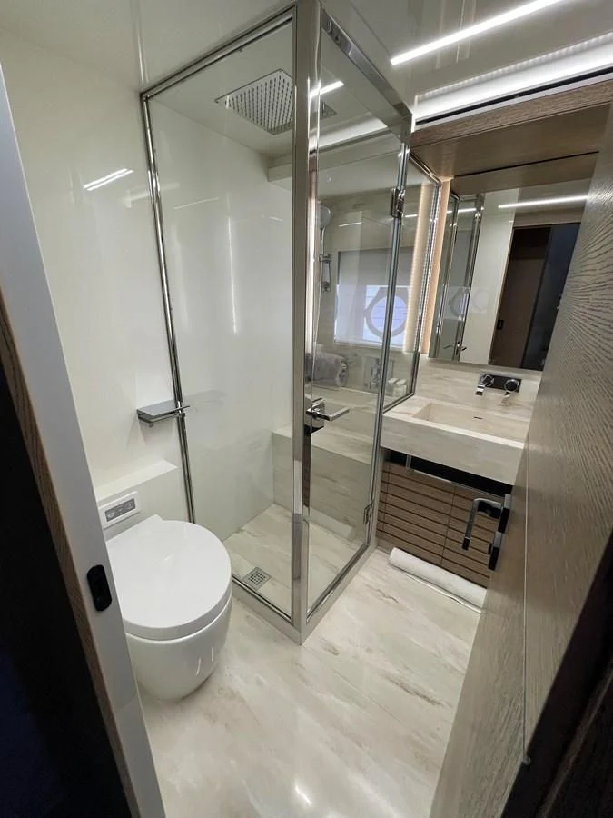 a bathroom with a glass shower aboard LEBRADA Yacht for Sale