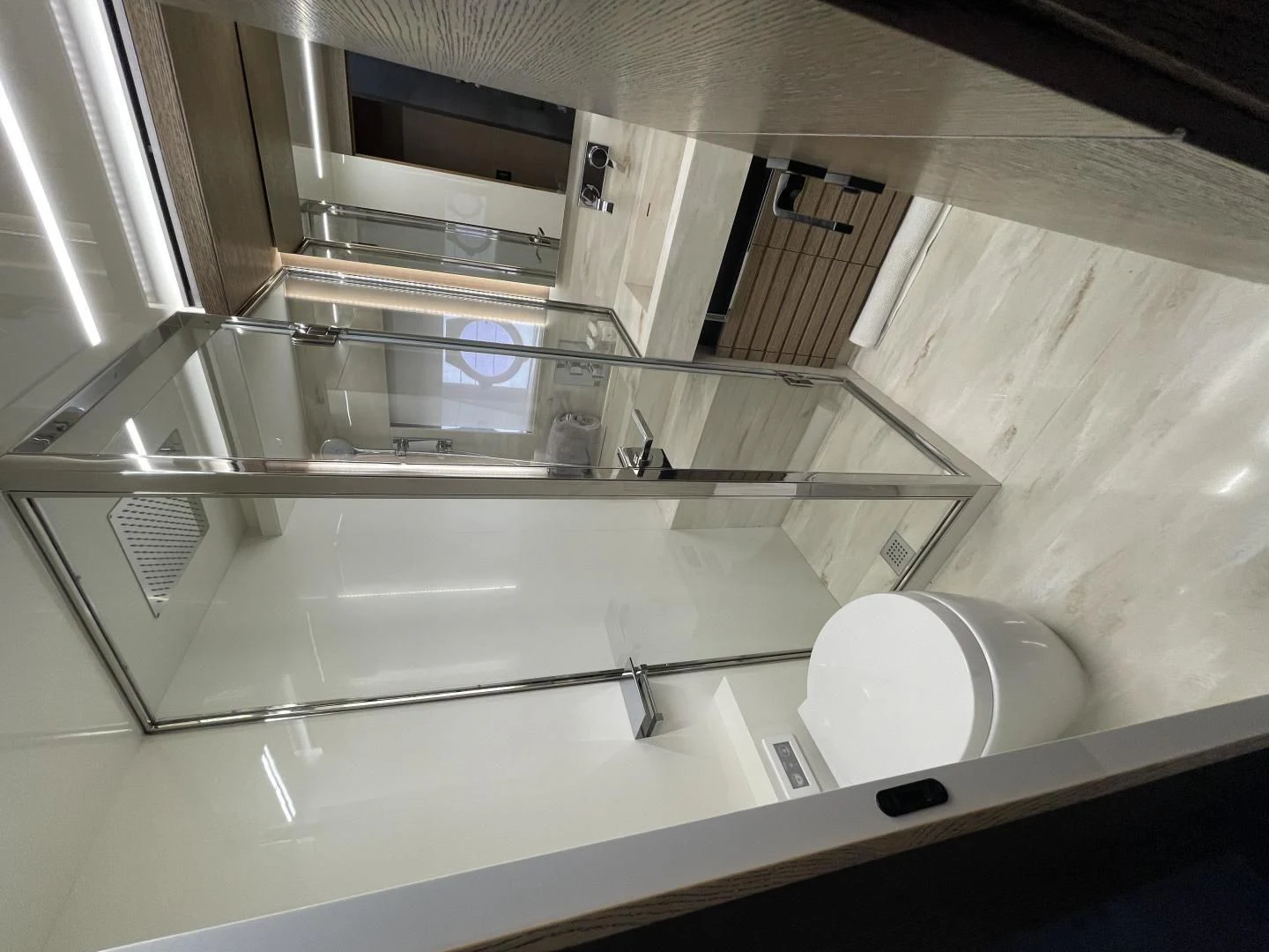 a bathroom with a sink and a mirror aboard LEBRADA Yacht for Sale