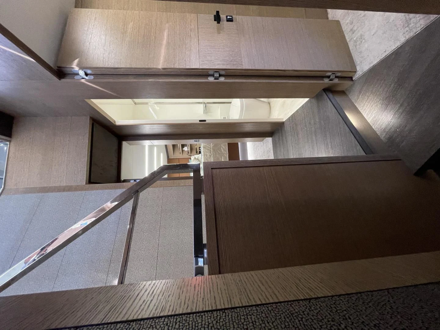 a large white and grey staircase aboard LEBRADA Yacht for Sale