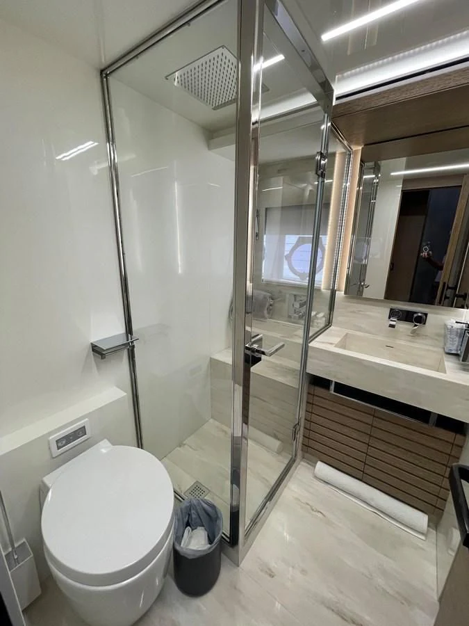 a bathroom with a glass shower aboard LEBRADA Yacht for Sale