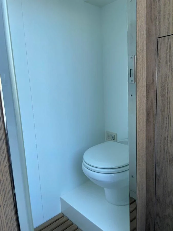 a toilet on a pedestal aboard LEBRADA Yacht for Sale