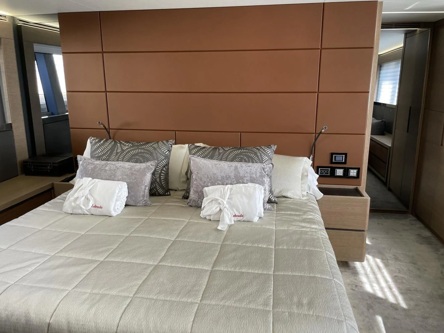 a bed with pillows aboard LEBRADA Yacht for Sale