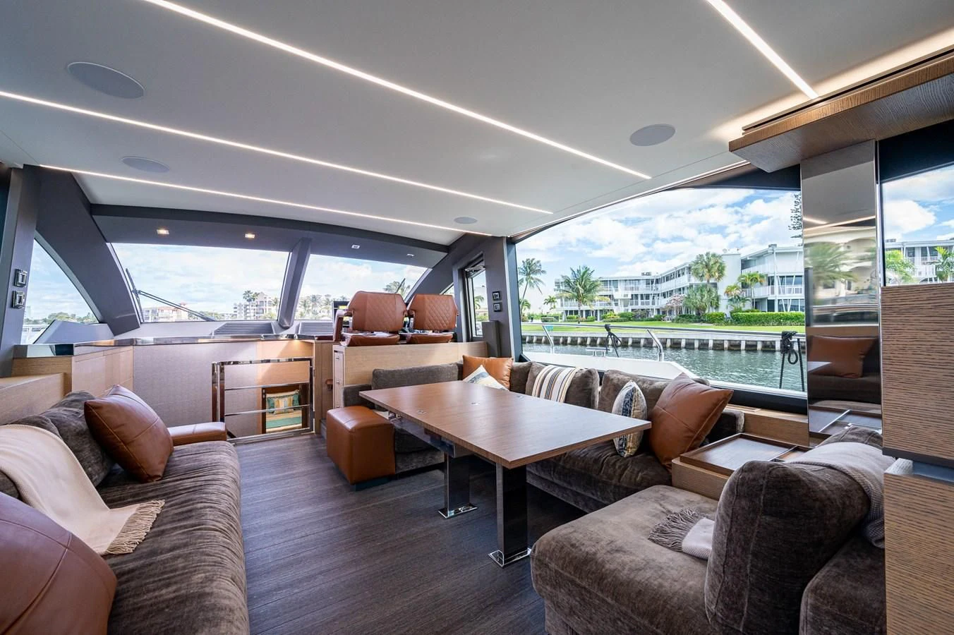 a living room with a large window aboard LEBRADA Yacht for Sale