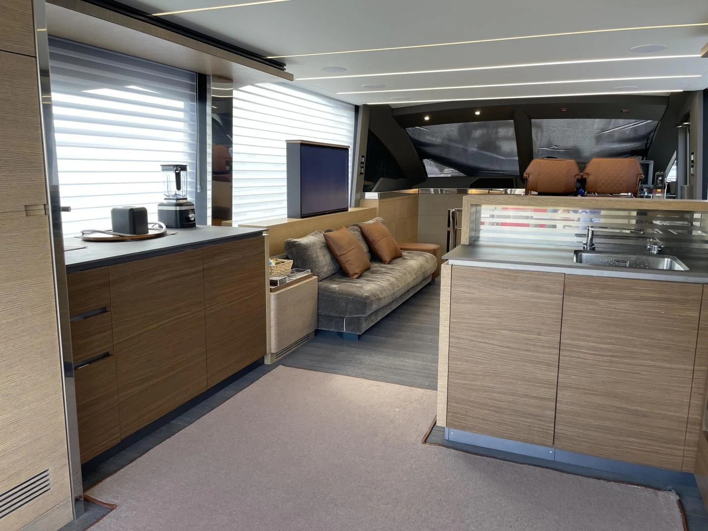 a room with a couch and a table aboard LEBRADA Yacht for Sale